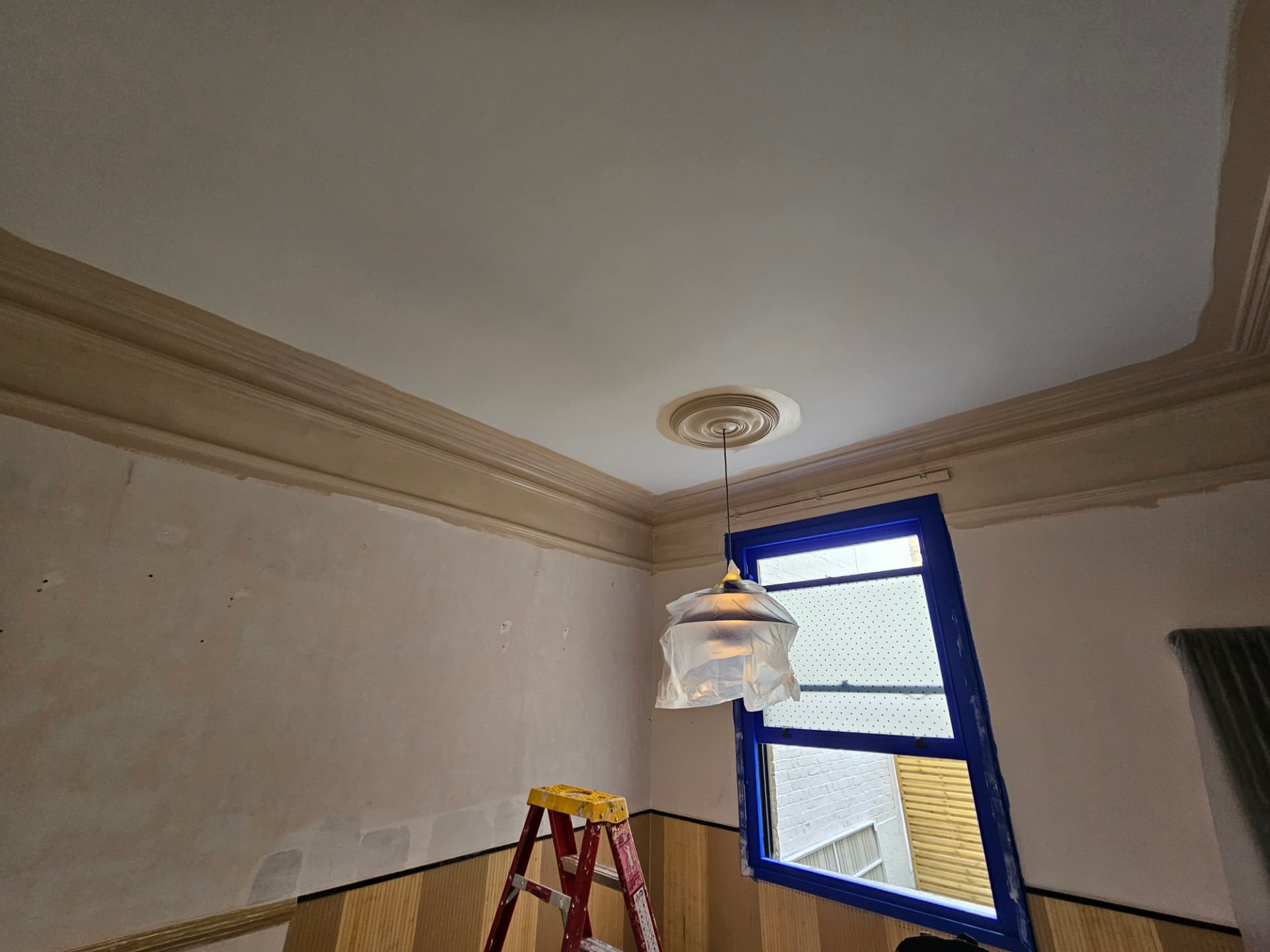 Before — Hackney five-colour room — designed with anna, lifedesign london. Ceiling detailing and masking in progress with furnishings protected.