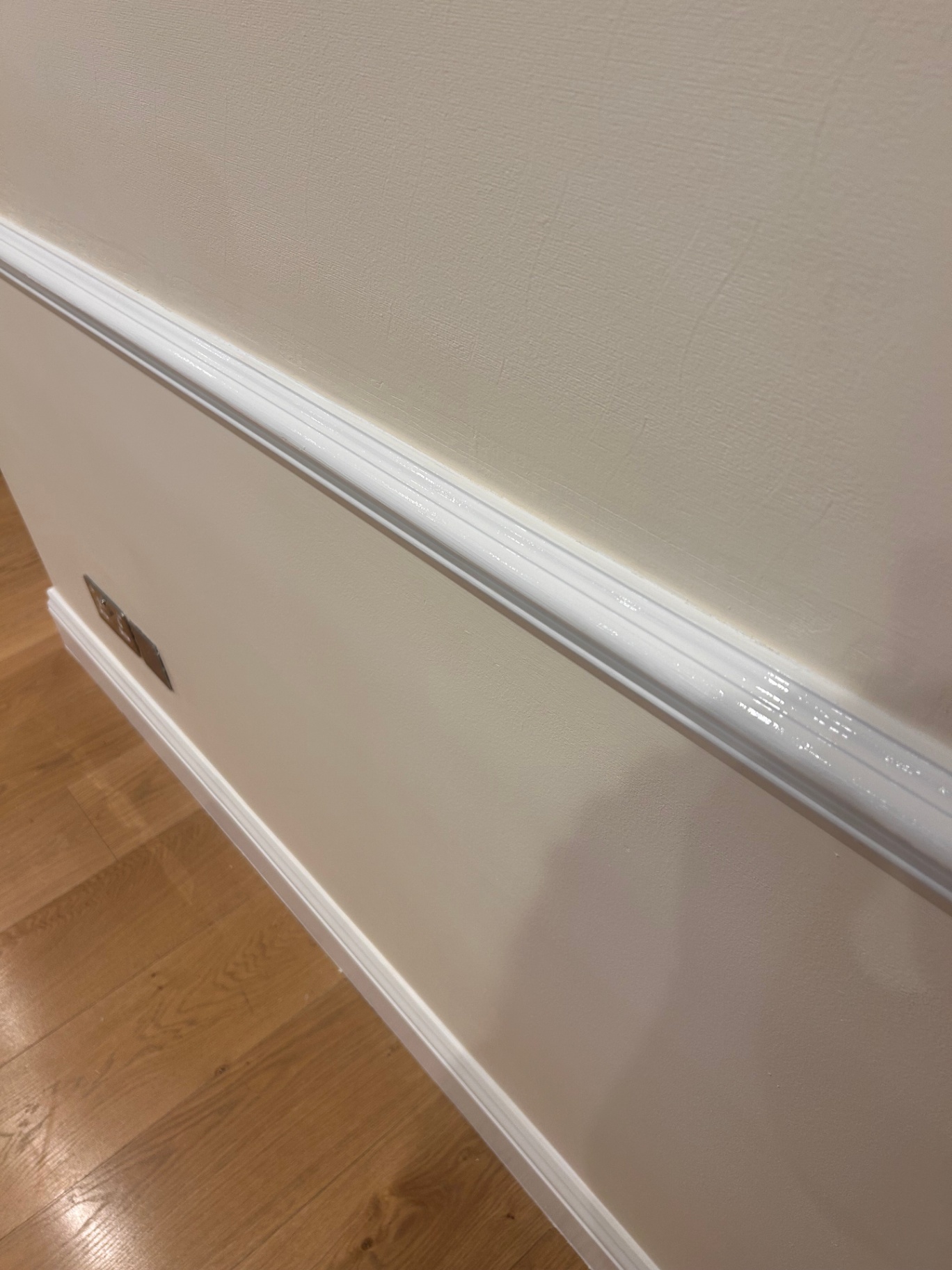 Eggshell white dado rail and skirting board contrasting Farrow & Ball Tallow 203 emulsion wall — Belgravia lower-ground room